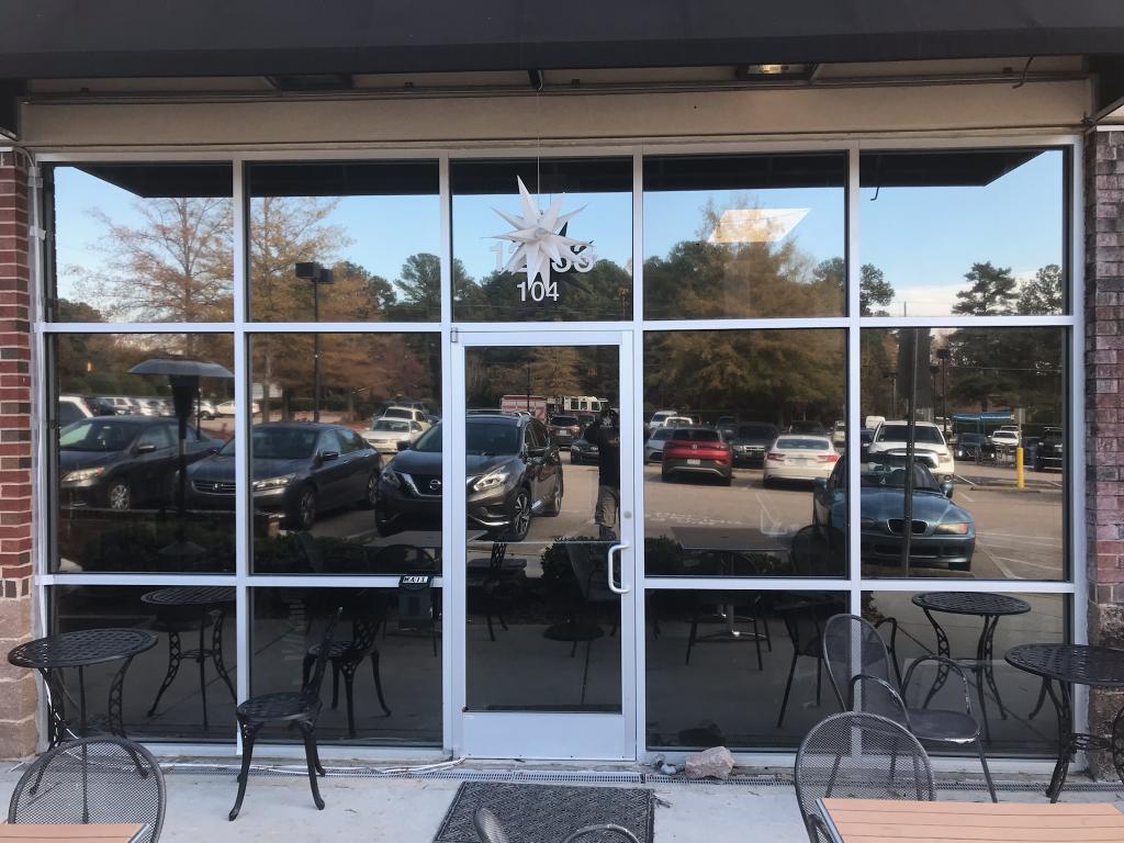Outside commercial building window tint reflective pink protection from uv rays Turbo Tint